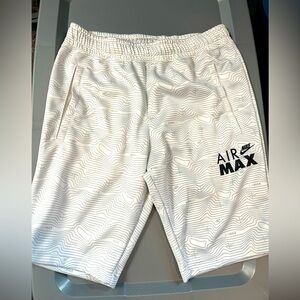 Boys Nike size Xl white and gray shorts.